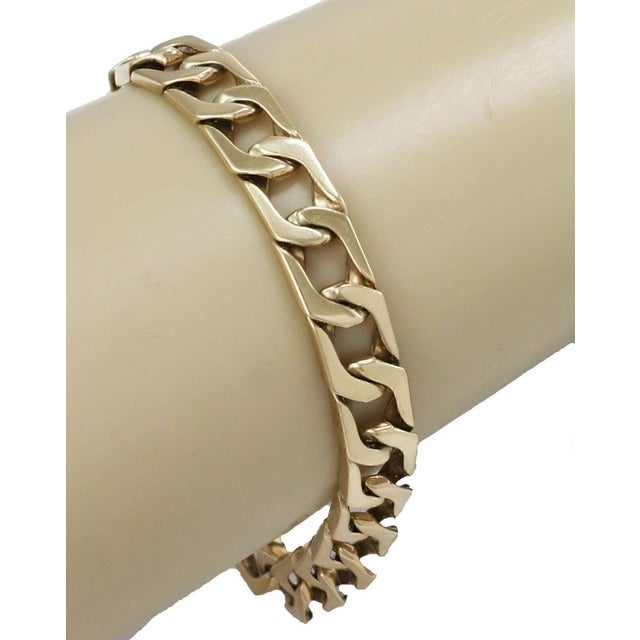 This Mens 14k Yellow Gold Wide Flat Open Curb Chain Link Bracelet is a classic and stylish vintage piece crafted in solid...