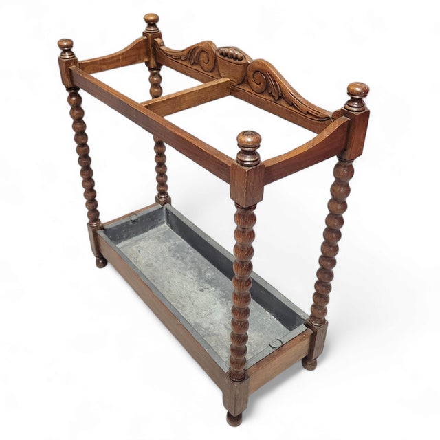 Steeped in history, this elegant antique umbrella stand is crafted from solid English oak, and features a timeless design...