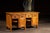 Substantial walnut workbench constructed with a thick plank top, paneled case sides, and an integrated system of drawers,...
