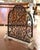 Sculptural ironwork and richly carved details give this vintage French fireplace screen an elegant decorative presence....
