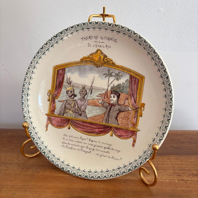 Charming late 19th century French faience collectible plate featuring a scene from the colorful Guignol Puppet Theater in...