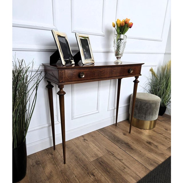 Very elegant and refined Italian Mid-Century Modern design console side table. Standing on four typically shaped wooden...