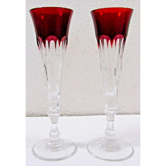 This set of two Faberge Xenia Ruby Red Crystal Champagne Flutes with Presentation Box is a luxurious and elegant addition...