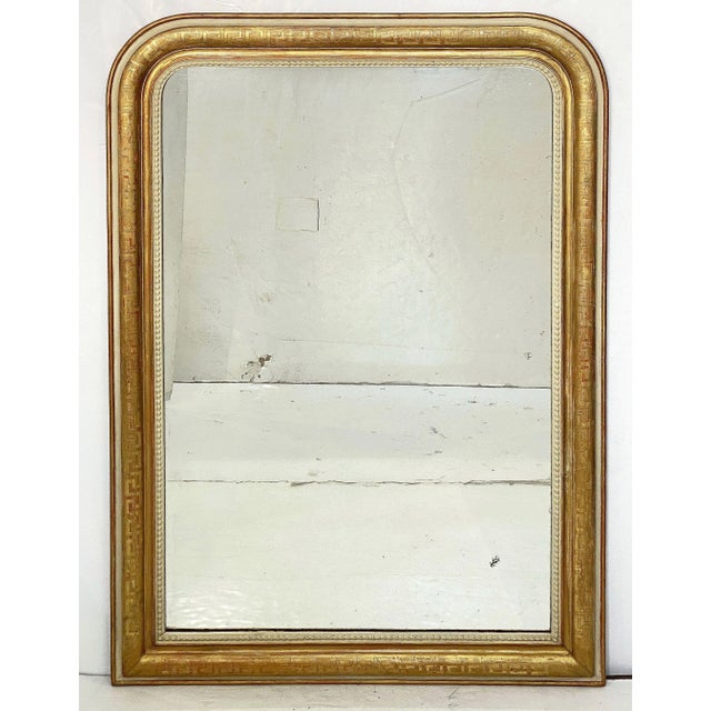 A fine large French arch top wall or overmantle mirror from the Louis Philippe period. Featuring a moulded surround with a...