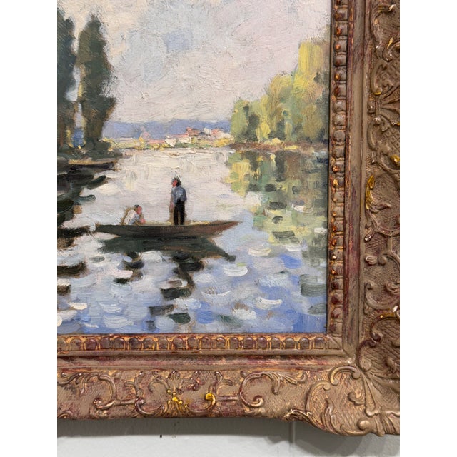 This is a lovely 19th Century French oil on canvas characterized by a serene river setting. The artist captures a small...