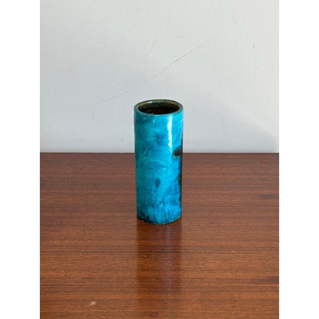 A wonderful vase by Guido Gambone featuring his so common rich blue glaze with abstract black coloring. A very restrained...