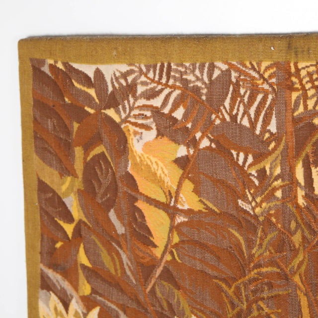 Large wool tapestry with a jungle motif inspired by Rousseau. Mounted on a stretcher frame, it is very decorative and...