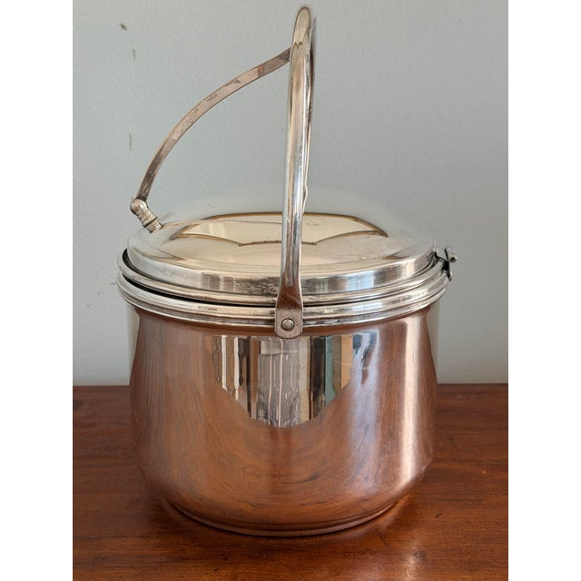 This is a wonderful silverplate ice bucket with the original glass liner. Very elegant and very much the sort of ice...