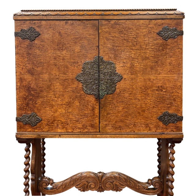 A striking William & Mary Revival cabinet on a stand that blends English Jacobean craftsmanship with Spanish-inspired...