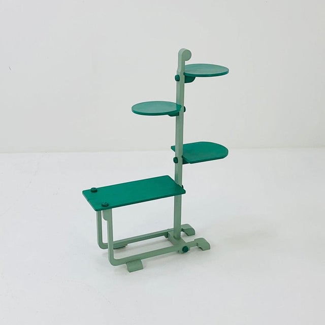 This flower stand designed by Adré Groult around 1925 is made of light green lacquered wood with green shelves. It is a...