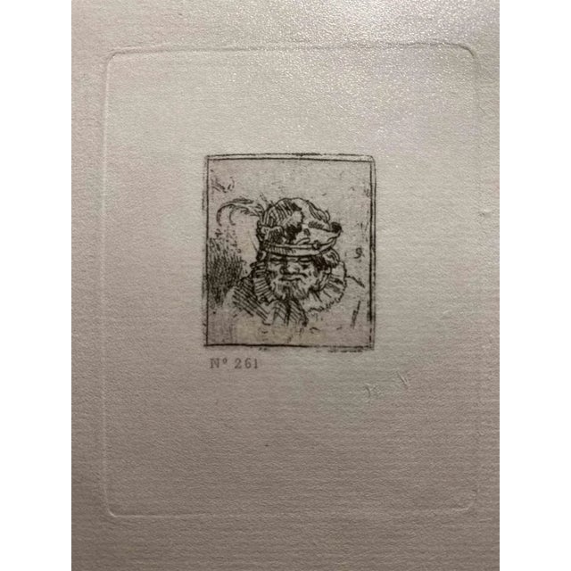 Portrait in Fur Cap is an etching on ivory-colored paper realized after an etching by Rembrandt. This piece of art belongs...