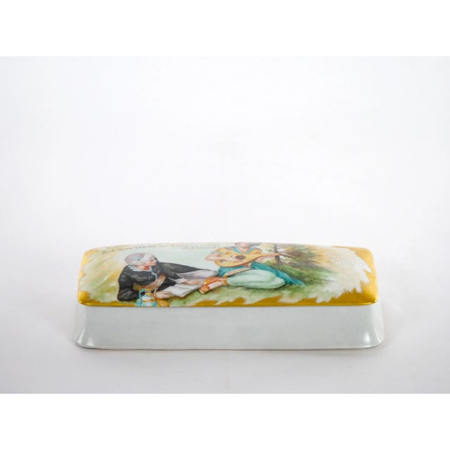 Beautifully hand painted and decorated gilt covered glazed porcelain decorative box. The box features a hand gilt and...