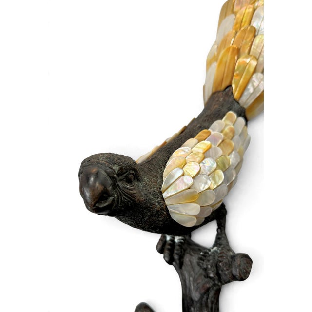 A pair of magnificent Maitland Smith cast bronze & mother-of-pearl parrot sculptures, perched on tree stumps. Excellent...