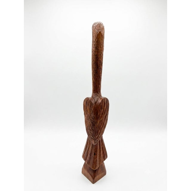 Add a touch of rustic charm to your home with this striking, hand-carved folk art wooden sculpture of a standing heron....