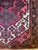 Hand-knotted wool rug with floral decoration from the 1970s. One small white stain to note (photographed).
