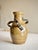 A beautifully restrained studio pottery vessel with a strong, sculptural presence. Hand-thrown with applied handles that...