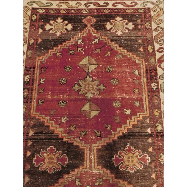 Origin: Persian. Construction: Hand knotted. Material: Wool pile on cotton foundation. Size: 3'x 9'6"