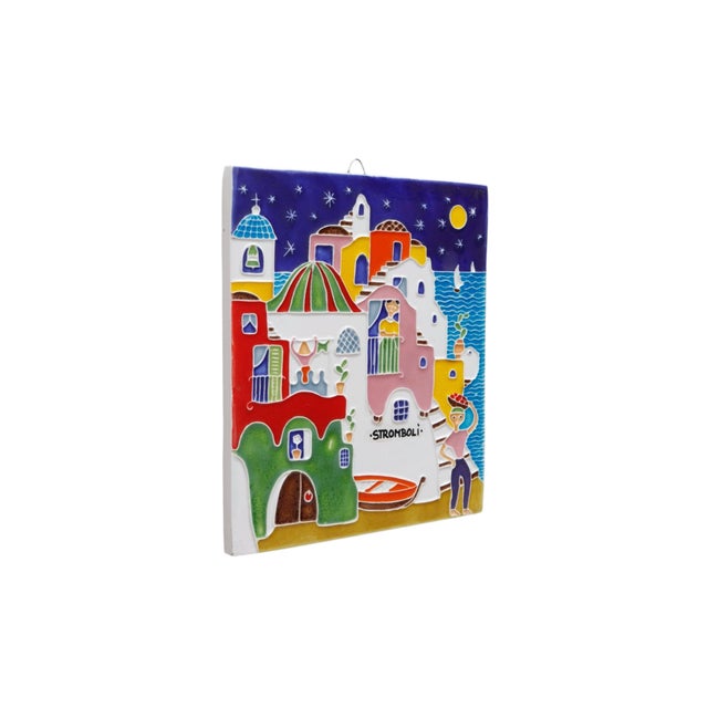 An Italian decorative wall art tile. The hand painted design in ceramic relief by Luciano Creations, features...