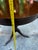Up for consideration is a beautiful vintage round mcm wooden side table with brass claw feet. This would look lovely in...
