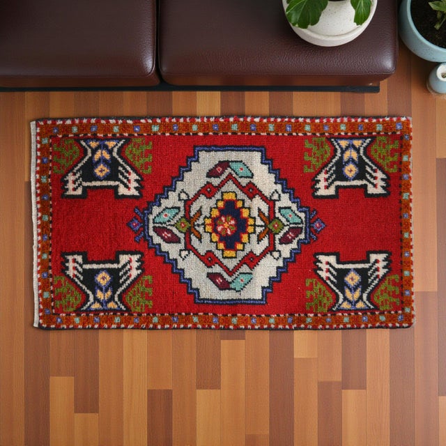 Elevate your living space with this vibrant hand-knotted small Turkish rug, a perfect accent piece for any entryway,...