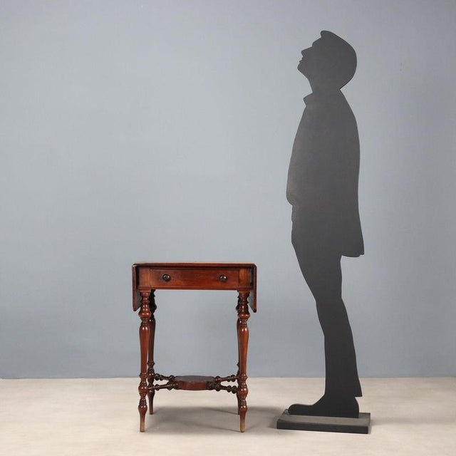 Mahogany side table with a box-shaped section beneath the top, four turned legs joined to the base by turned crosspieces,...