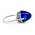 An alluring modern fine jewelry ring crafted in solid 18k white gold, featuring an impressive, high-dome oval cabochon...