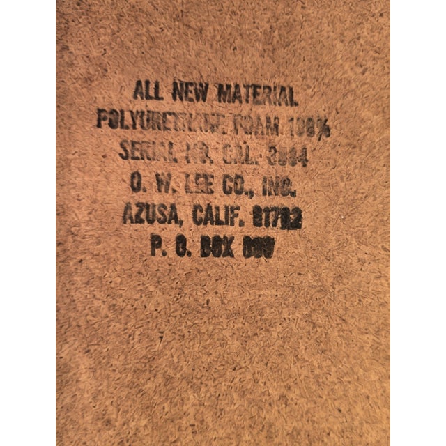 Vintage O.W. Lee “Alphonse” wrought iron patio set featuring four lounge chairs, round glass-top coffee table, and...