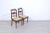 Elegant pair of wooden chairs, original design and production from the early 20th century. Solid wooden frame with carved...