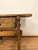 18th century Spanish side table handcrafted from solid wood. This small, rustic piece features a thick plank top, simple...