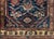 A stunning early 20th century Persian Hamadan rug with a beautiful all-over stylized floral pattern woven in crimson,...