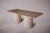 Elevate your dining experience with our exquisite Travertine Dining Table featuring cylindrical legs and vertical stone...