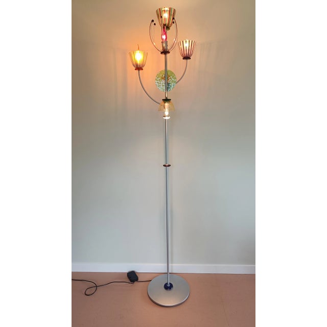 This glass and metal floor lamp light is designed by Andrea Anastasio as part of the 1990 Milano Venezia Artemide edition....