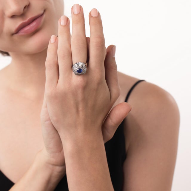 This impressive vintage sapphire and diamond ring pendant is a bold 1980’s design, centered by a round cut sapphire...
