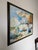 A beautiful 1970s original oil on canvas by listed artist John Adamos Manol, depicting a charming outdoor florist market...