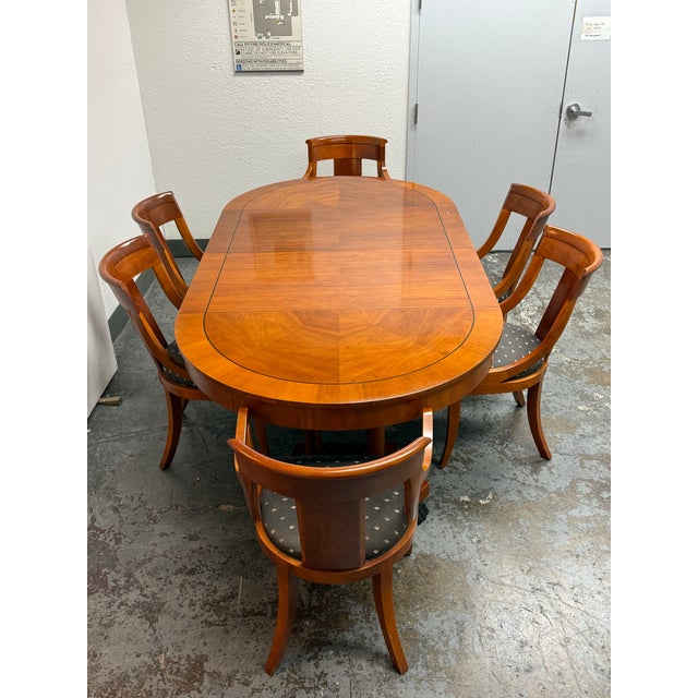 Design Plus Gallery presents the Vintage Palladian Extension Dining Table + Six Chairs from Baker Furniture. The set...