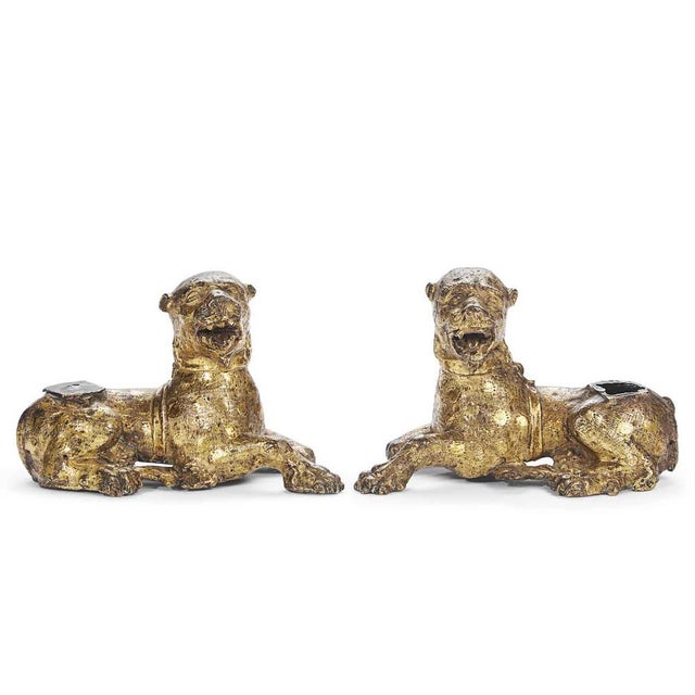 A pair of gilded bronze lions, Nuremberg, circa 1500, probably originally used as the legs of a coin cabinet or cabinet...