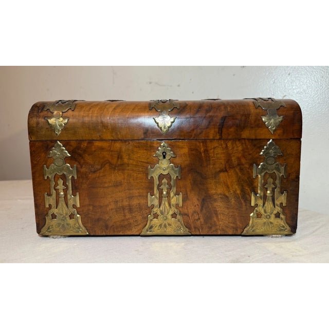 A Superb Quality Mid 19th Century Burr Walnut Tea Caddy Having Original Brass Mounted Decoration And Domed Lid Enclosing...