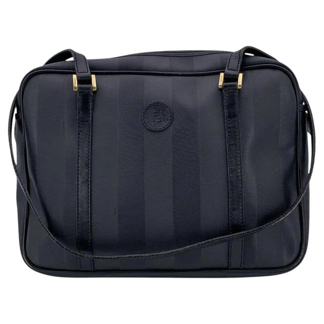 This authentic Fendi shoulder bag is a sophisticated example of the house's understated Pequin aesthetic, featuring the...