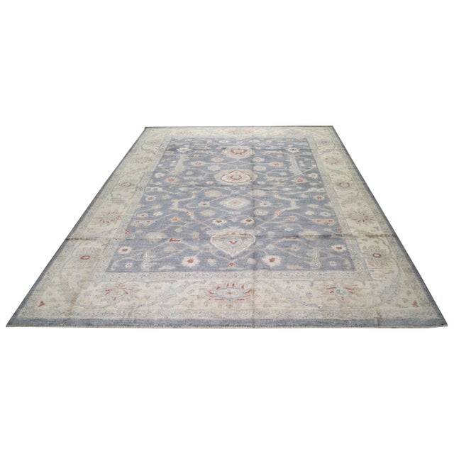 Hand-knotted with care using traditional rug making techniques, this wool rug blends timeless craftsmanship with a modern...