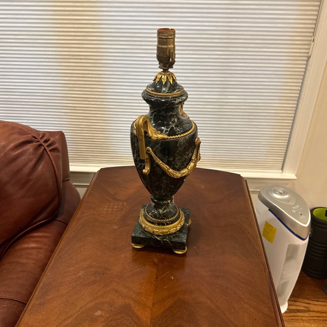 This is an antique French Louis XVI style gilt bronze-mounted green marble urn lamp. It dates from the late 19th century,...