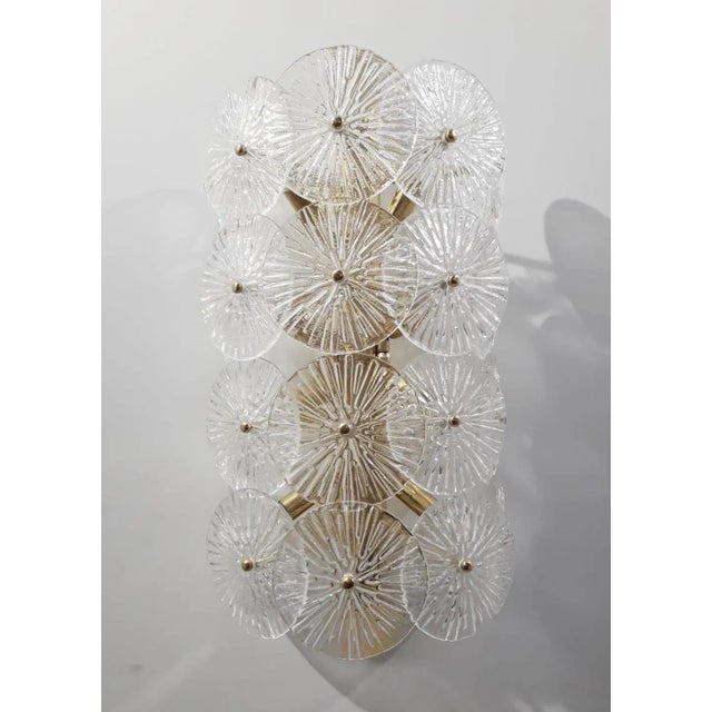 Oversized impressive Italian wall light with clear textured Murano glass discs mounted on solid brass frame in polished...
