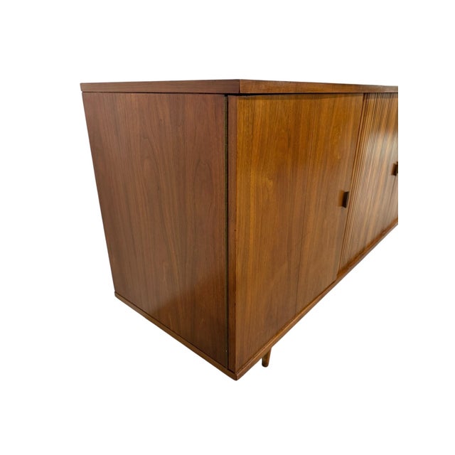 Elevate your living space with this stunning Mid-Century Modern Tambour Media Sideboard, a timeless blend of form and...