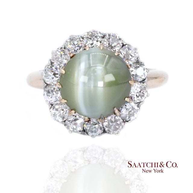 Cat's Eye and Diamond Ring Metal Type: 14K Gold, White Gold Total Item Weight: 5.6 Grams Ring Size: 5.25 (Resizable)...