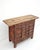 Dating to 1806, this antique sideboard is made from solid elm wood, showcasing a hand-carved facade with deep scrolling...
