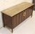 This is a stunning travertine topped walnut credenza. This piece is in the Hollywood Regency style. This piece is accented...