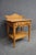 Oak nightstand attributed to American of Martinsville, featuring a clean, classic silhouette with a single drawer over an...