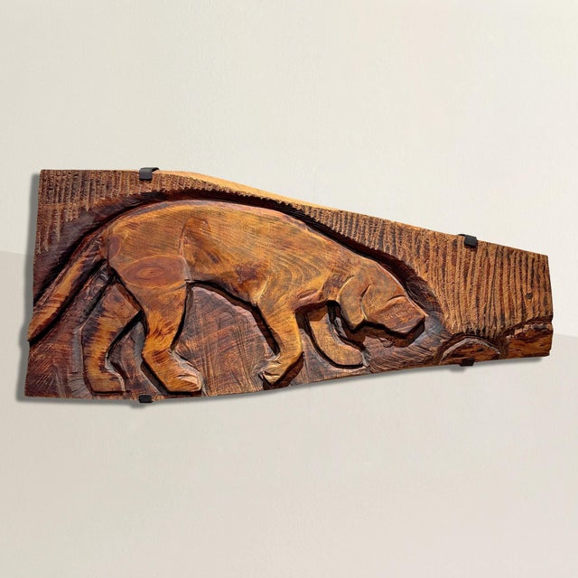 Head down, nose to the invisible current of scent, this late 20th century American folk art Labrador is locked in. The low...