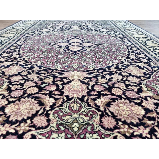 Handmade antiaue Persian Isfahan rug in traditional floral design with large medalllioin. The rug is from the beginning of...