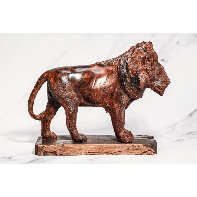 Commanding and richly sculptural, this exceptional antique Victorian hand-carved wooden lion statue is a striking example...