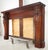 Antique Renaissance Revival fireplace mantel made of a dark stained wood with carved lion heads on each side. Good antique...